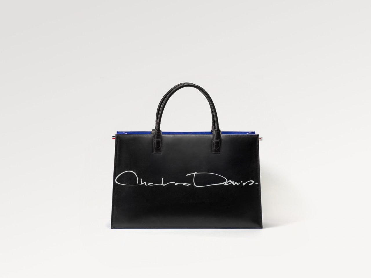 Luxury black leather tote bag handcrafted by Charles Darius, photographed in studio — sculptural silhouette and minimalist French design.