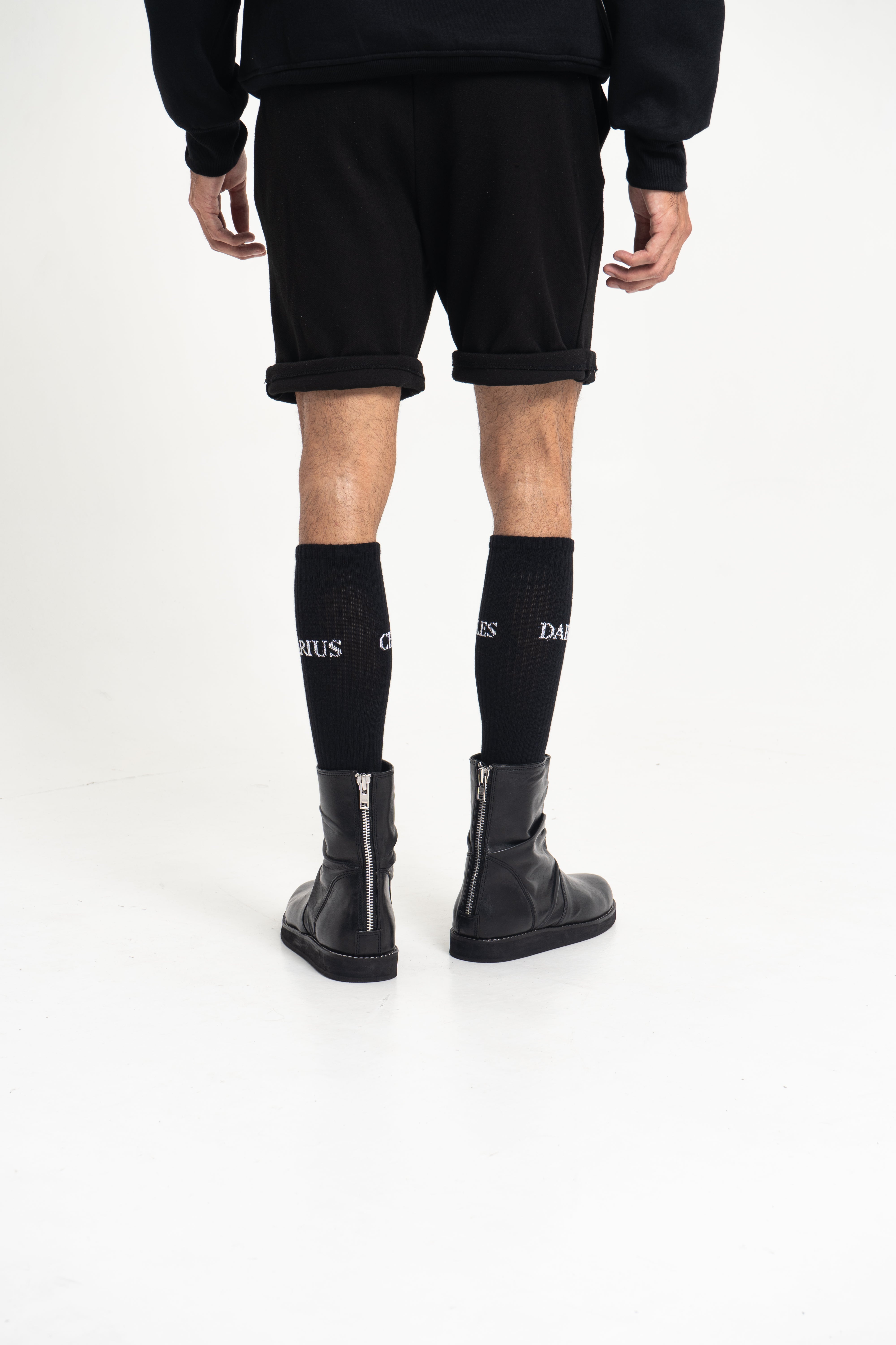 Male model wearing Charles Darius High Socks – side profile