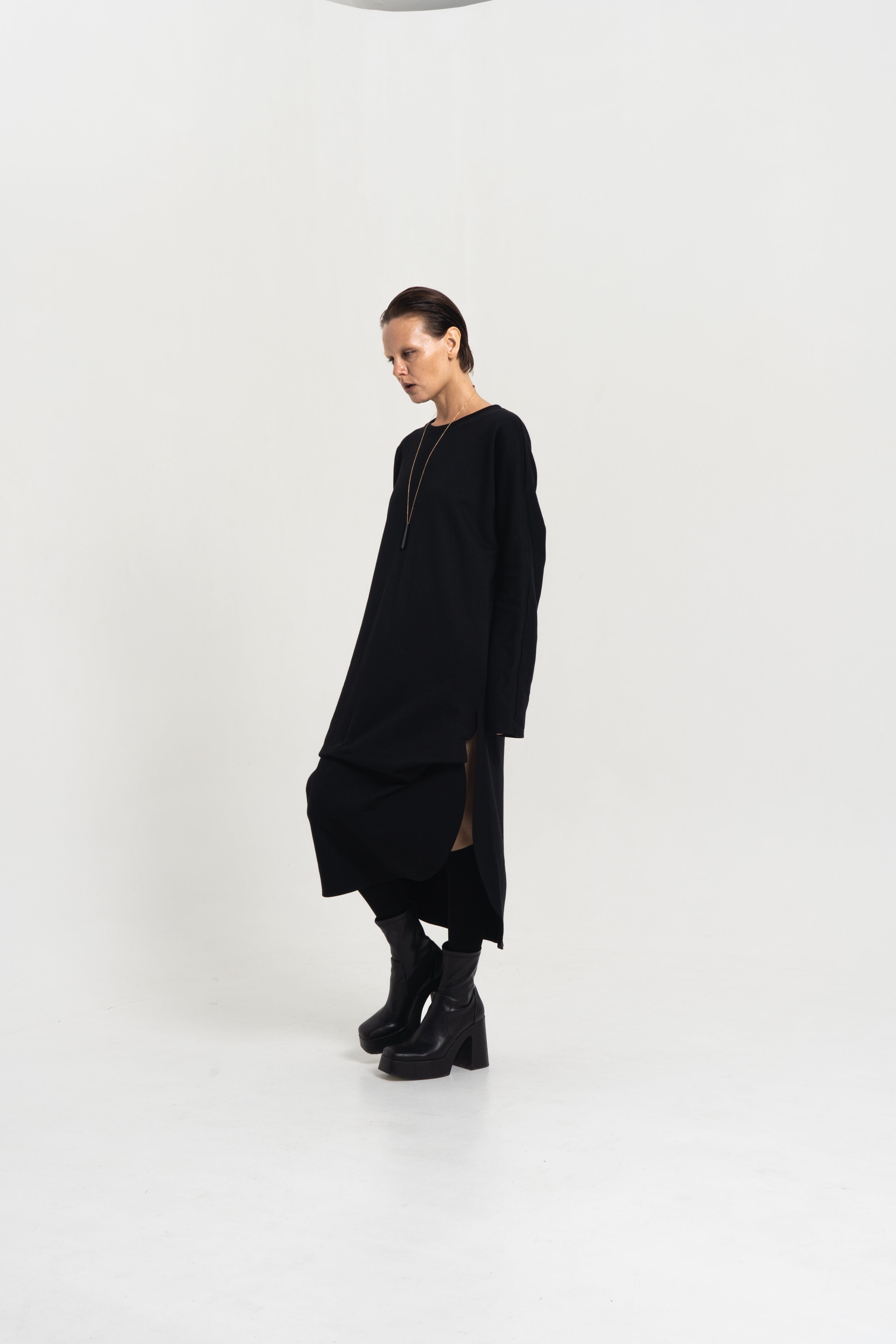 Female model wearing the Origami Tunic Shirt – front view, black Japanese cotton